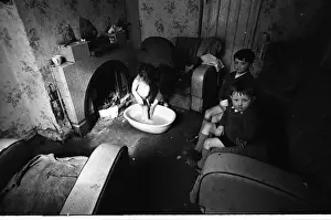 Woman bathing baby, Falls Road, Northern Ireland