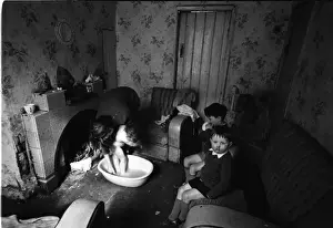 Woman bathing baby, Falls Road, Northern Ireland