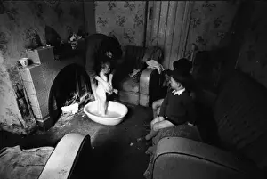 Woman bathing baby, Falls Road, Northern Ireland