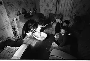 Woman bathing baby, Falls Road, Northern Ireland