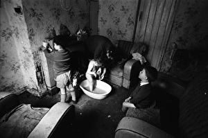 Woman bathing baby, Falls Road, Northern Ireland