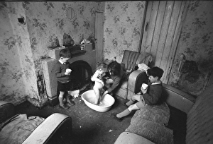 Woman bathing baby, Falls Road, Northern Ireland