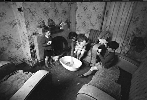 Woman bathing baby, Falls Road, Northern Ireland