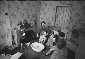 Woman bathing baby, Falls Road, Northern Ireland