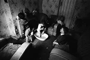 Woman bathing baby, Falls Road, Northern Ireland