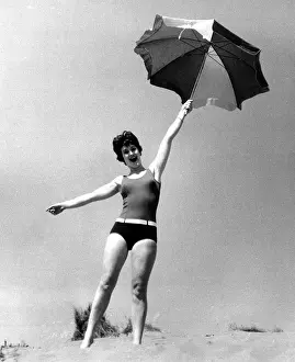 Woman on beach with sunshade
