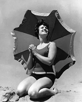 Sunshade Prints: Woman on beach with sunshade