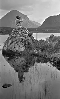 Binoculars Prints: Woman with binoculars, Portree, Isle of Skye, Scotland