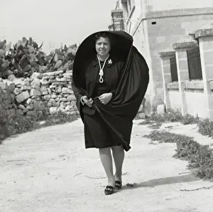 Billowing Prints: Woman in black, with pearls and brooch