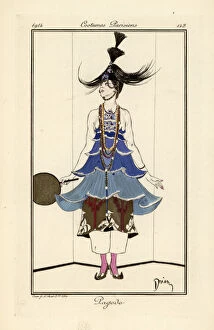 Woman in a blue pagoda dress with necklaces and pantaloons