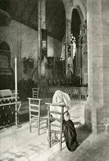 Candles Gallery: Woman in a Catholic church, Brittany, Northern France