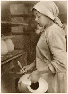 Images Dated 7th June 2021: Woman at the cleaning stage of pottery-making. Date: 1913