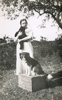 Crate Prints: Woman with a dog and a cat in a garden