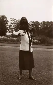 Woman and dog in garden