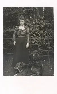 Woman with a dog in a garden