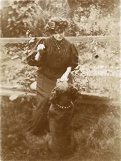 Woman with a dog in a garden