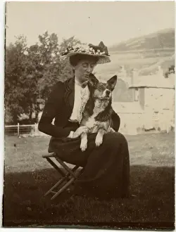 Woman with dog in a garden