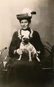 Woman with dog in studio photo