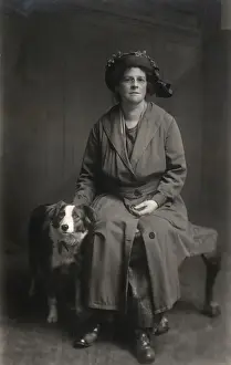 Raincoat Prints: Woman with dog in studio photo