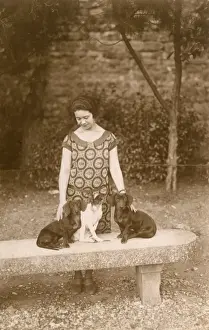 Sausage Prints: Woman with three dogs