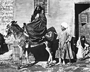 Woman on a donkey, Egypt
