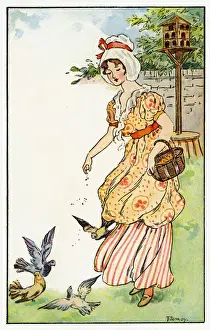 Woman feeding pigeons