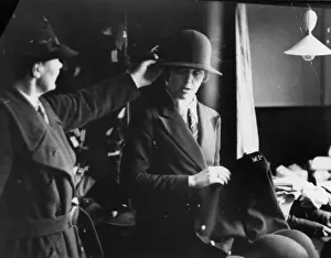 Woman being fitted with policewomans uniform