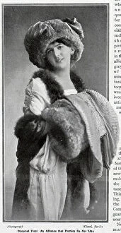Frocks Collection: Woman in furs, model wearing fur hat, muff, and stole. Captioned, Distorted furs