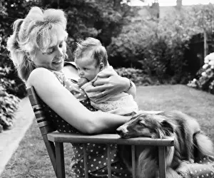 Spotty Prints: Woman in garden with baby and dog