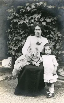 Frowning Prints: Woman and girl with dog in a garden