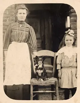 Lacy Prints: Woman and girl with dog outside a house, Belgium