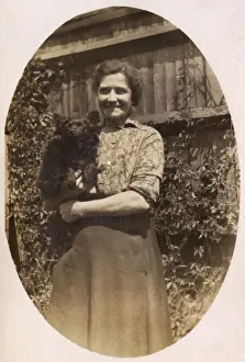 Woman holds her dog