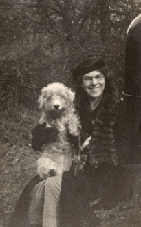 Woman holds her dog
