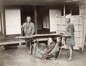 Woman in a kago, carrying chair with porters, Japan