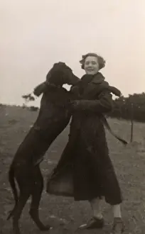 Walkies Prints: Woman with large dog in a field