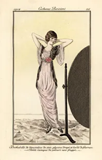 Images Dated 12th April 2019: Woman in lilac dress looking at herself in a mirror