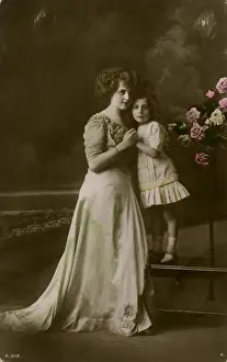Woman and little girl in studio photo