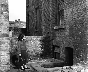 Woman and Liverpool derelict house