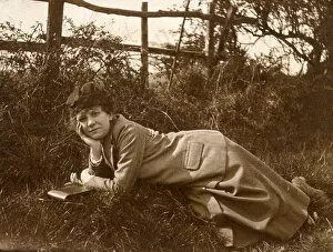 Woman lying on grass in a field