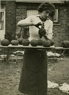 Economical Prints: Woman making balls of clay and slack, West Country