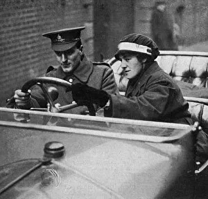 Woman motor driver teaching soldier to drive, WW1