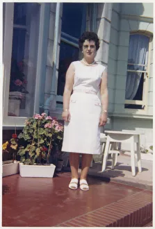 Images Dated 4th February 2021: Woman outside a British Seaside Guesthouse