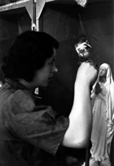 Airbrush Gallery: Woman painting plaster figurine