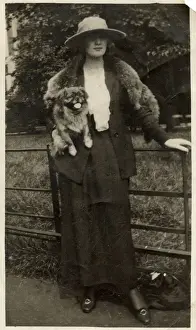 Pekingese Prints: Woman with Pekingese dog in a park