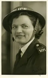 Woman police officer in air raid helmet, London, WW2