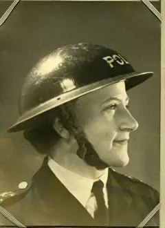 Woman police officer in air raid helmet, London, WW2