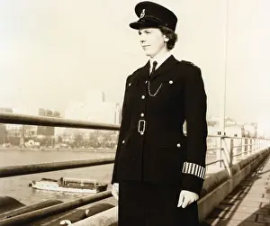 Woman police officer on a bridge in London