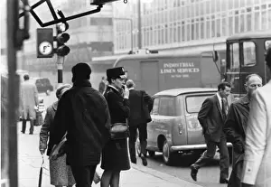 Woman police officer on a busy London street