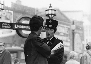 Alison Gallery: Woman police officer on a busy London street