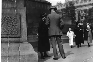 Woman police officer chatting to a pedestrian, London